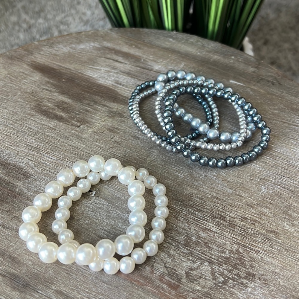 Costume pearl bracelet stacks.